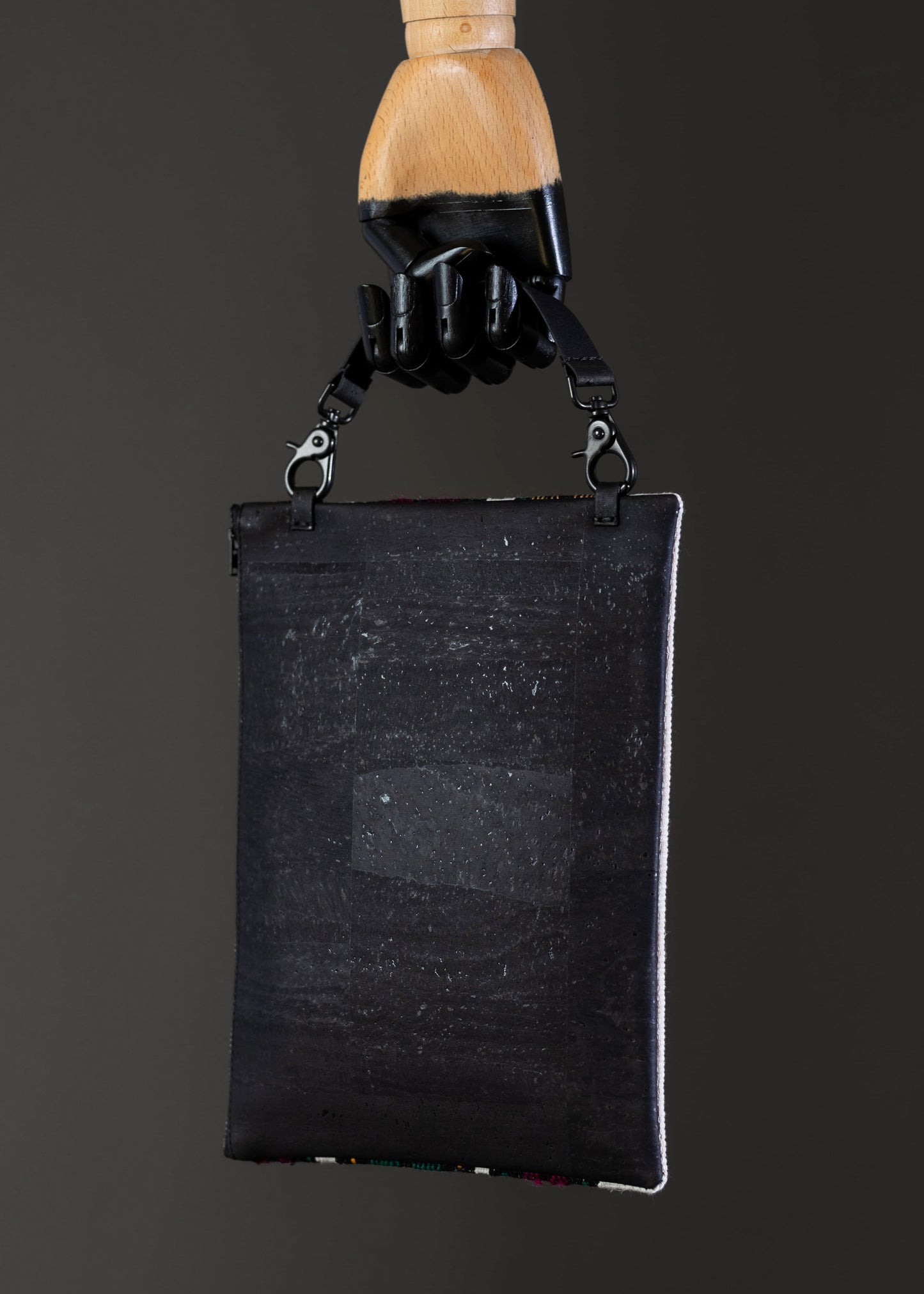 Back view of FTLO bag showcasing the black cork fabric.