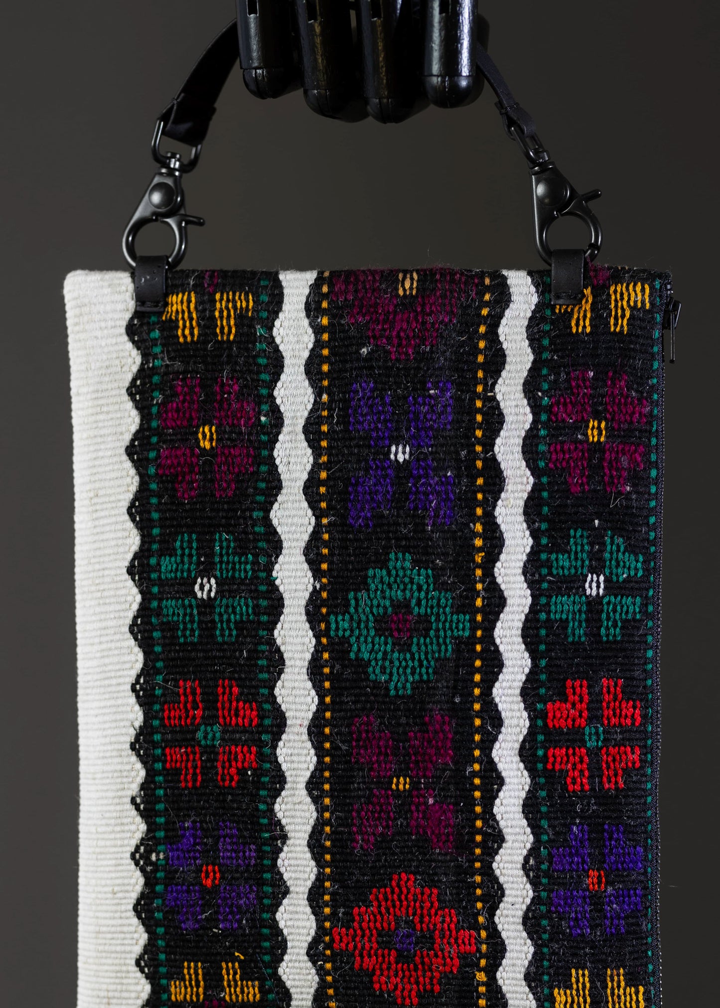 Close-up of the intricate floral motif on FTLO's vintage handwoven striped bag
