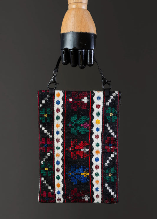 Front view of FTLO garden palette vintage clutch with a vivid floral design.