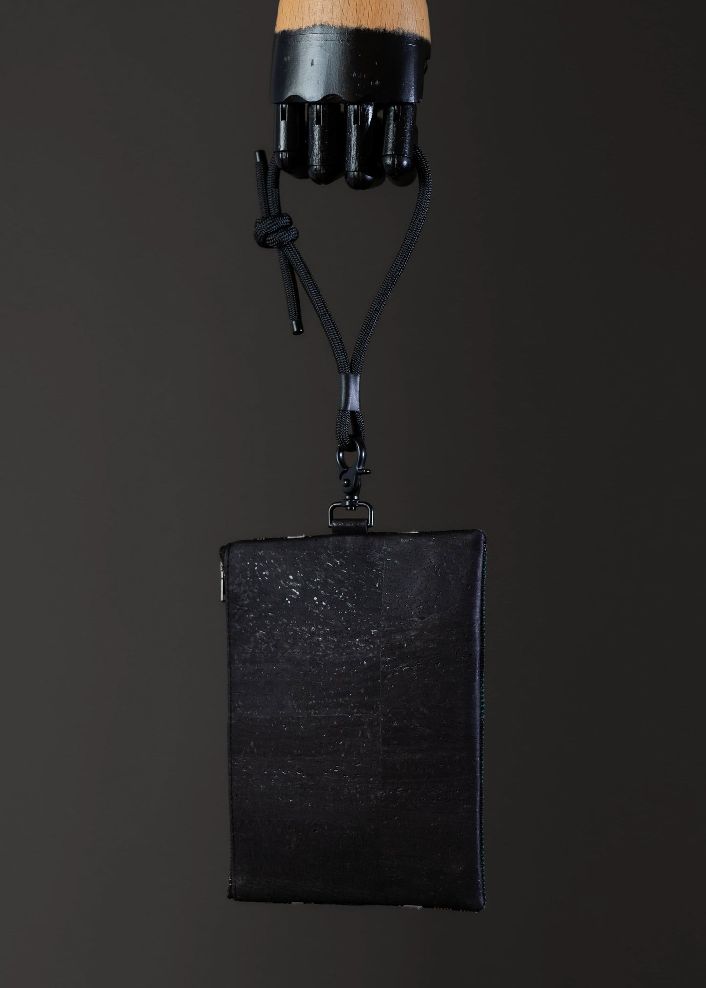 FTLO multicolor abstract bag showing the black cork fabric on the back.