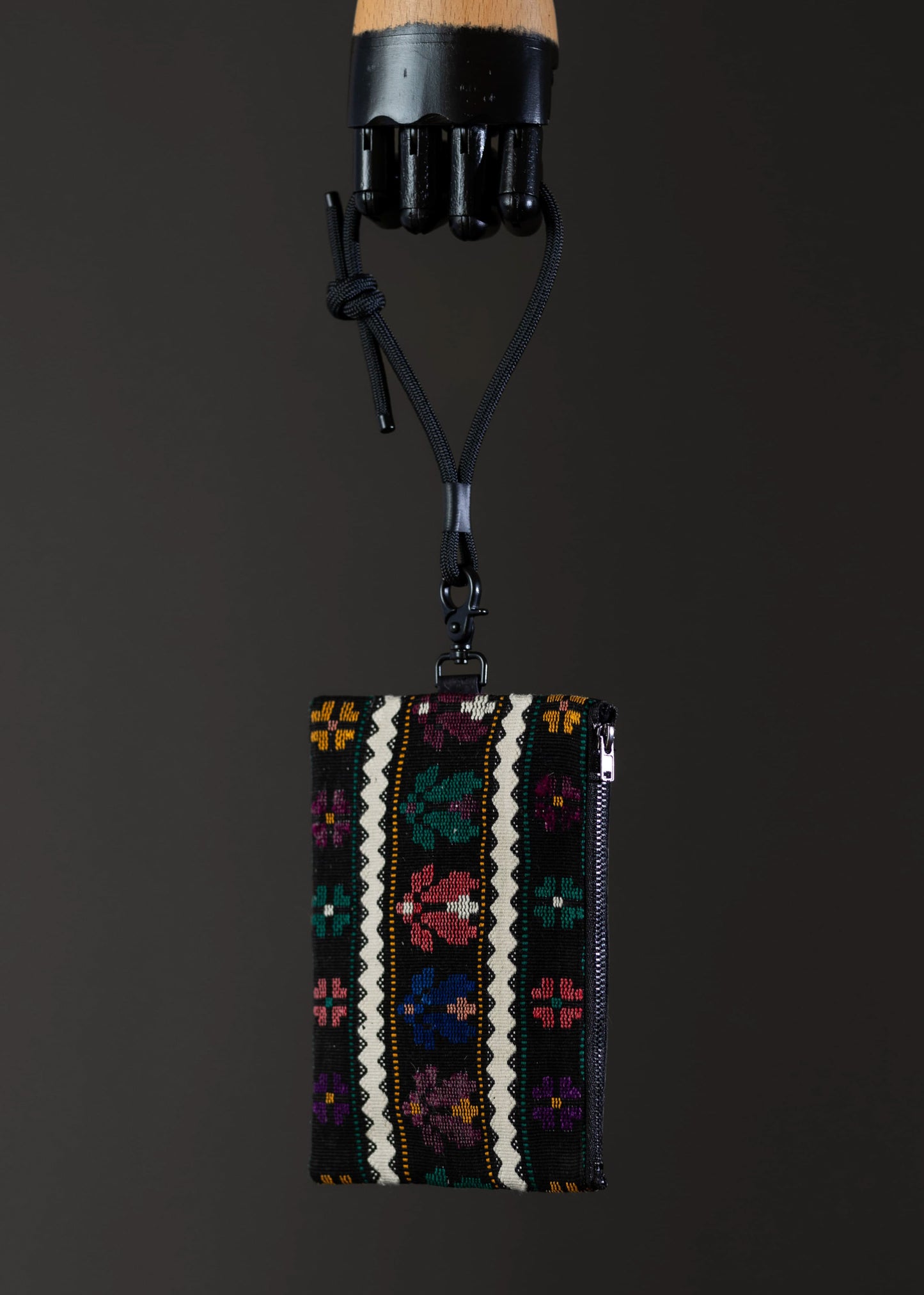 Side view of the FTLO multicolor abstract floral bag with a detailed stitch pattern.