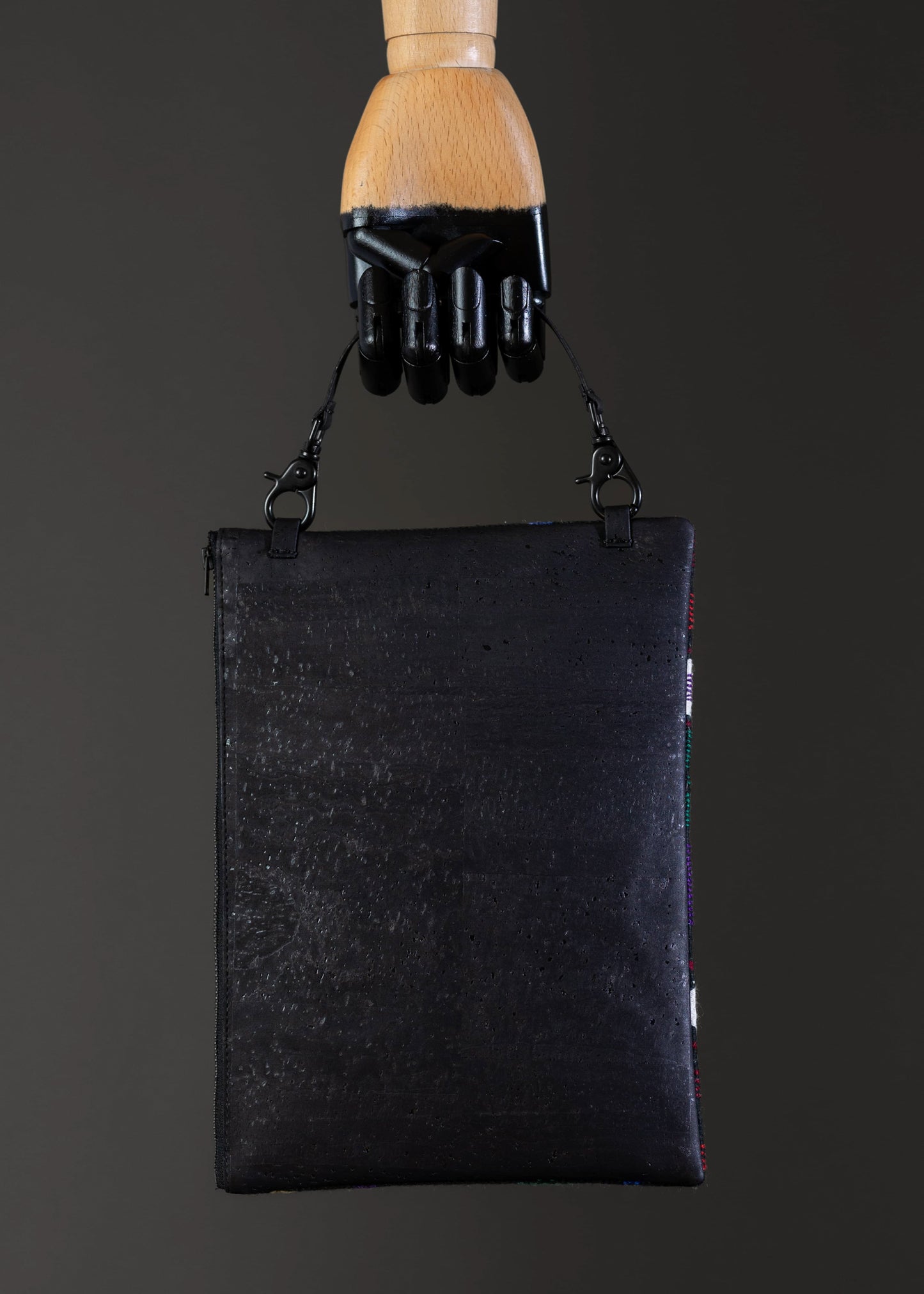 Back view of FTLO multicolor floral woven clutch showing the black cork.