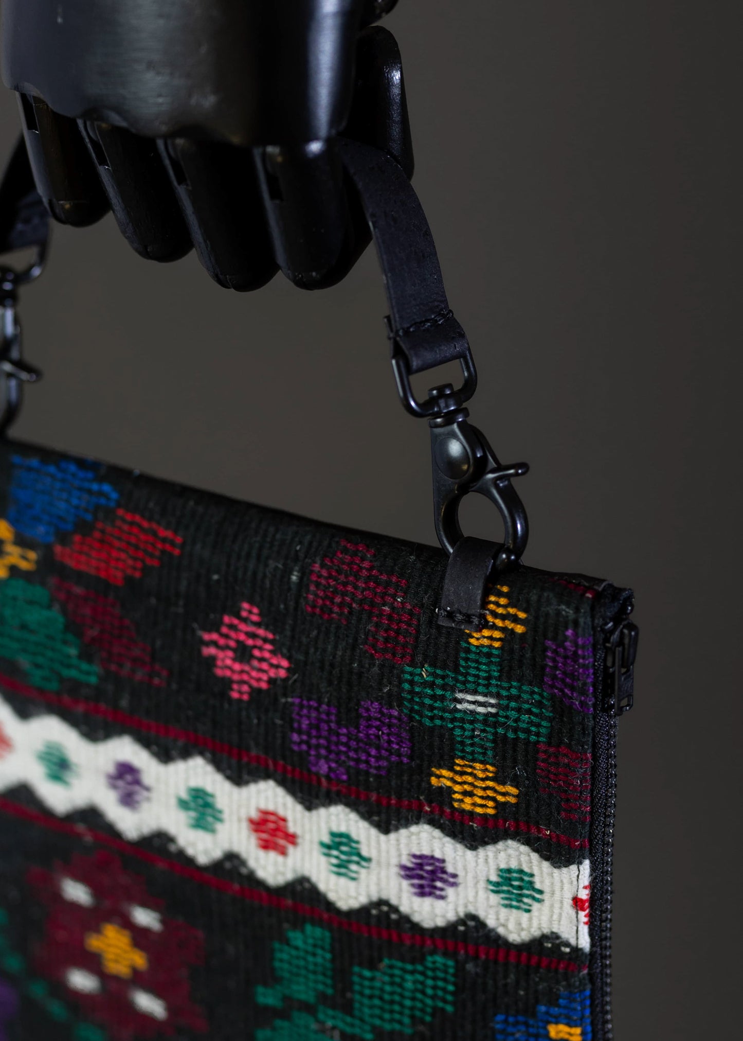 Close-up detail of FTLO multicolor floral woven clutch's intricate stitching.