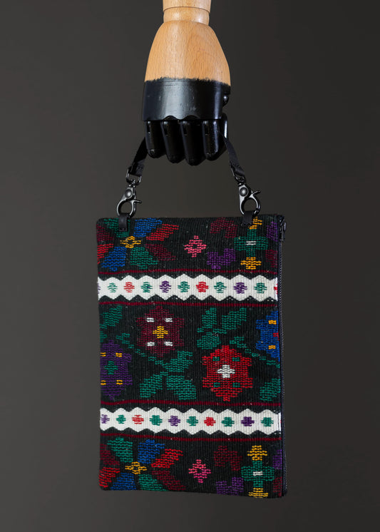 Front view of FTLO multicolor floral woven clutch with intricate patterns.