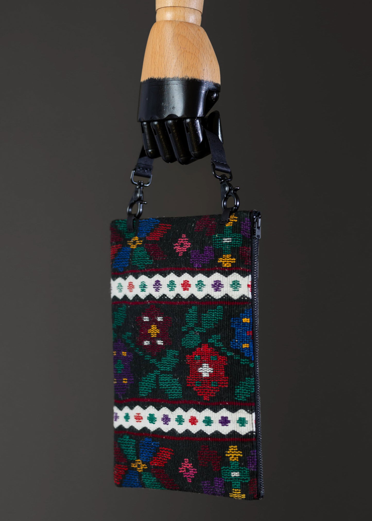Side view of FTLO multicolor floral woven clutch highlighting the craftsmanship.