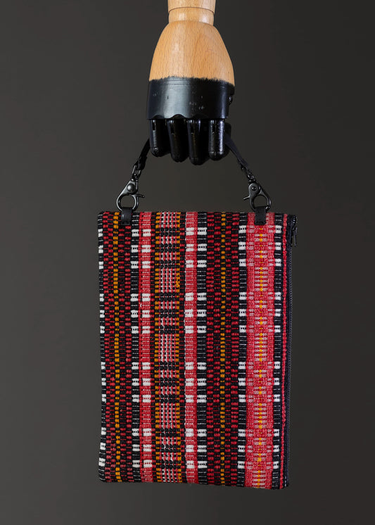 Front view of FTLO red stripe vintage clutch, showcasing vibrant handwoven patterns.