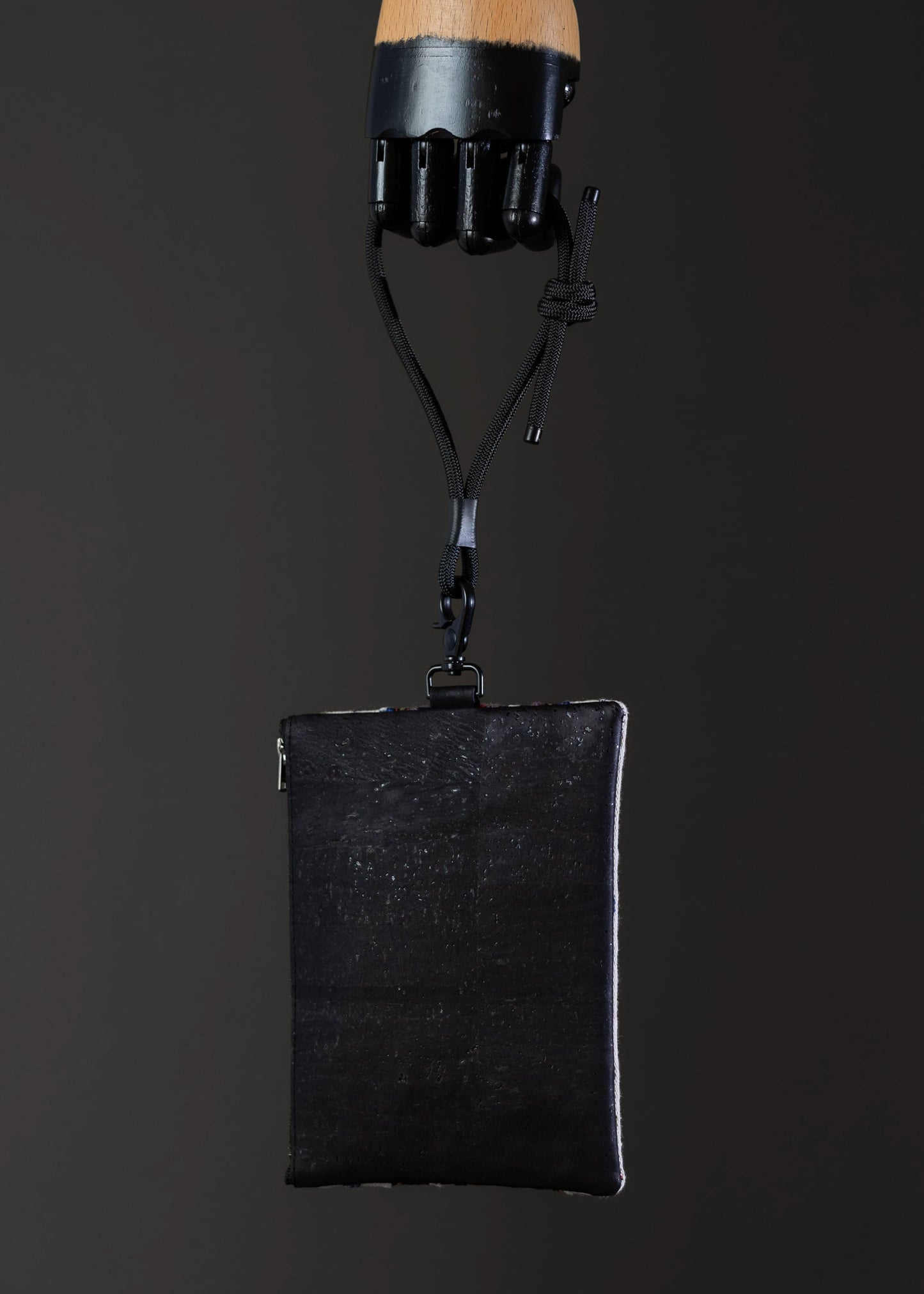 FTLO multicolor geometric small bag showing the black cork fabric on the back.