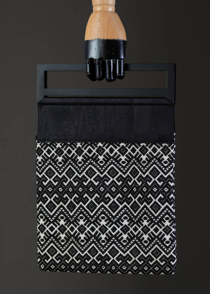 Front view of FTLO black and white geometric-patterned bag, displaying a bold and contrasting design.