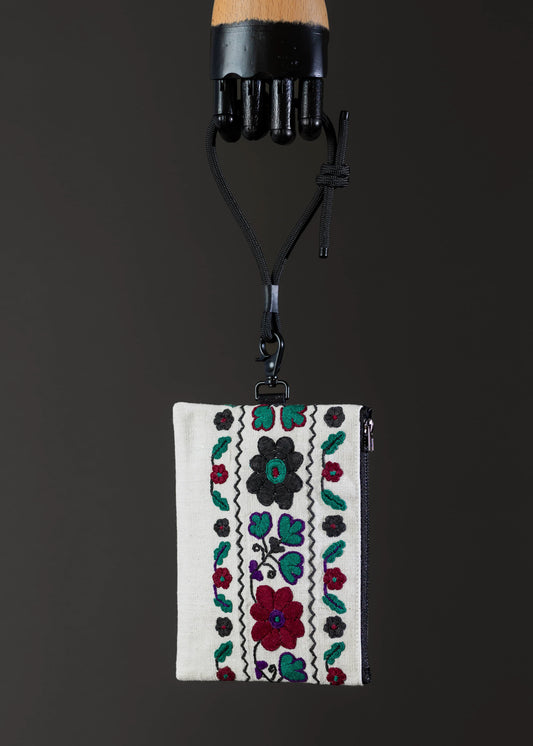 Front view of FTLO bag with intricate garden-inspired embroidery in vibrant hues.