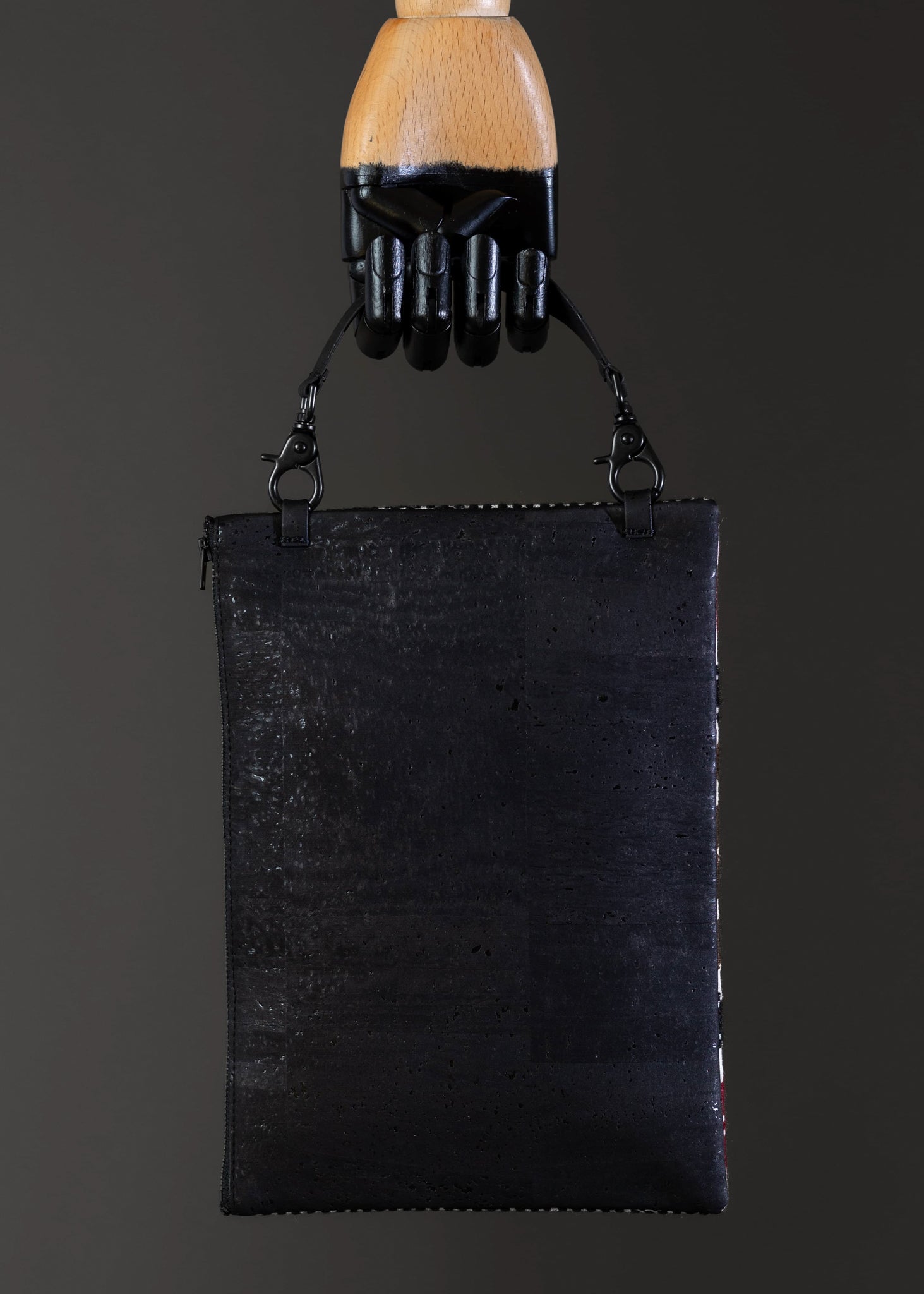 Back view of the earthy tones FTLO bag showing the black cork.