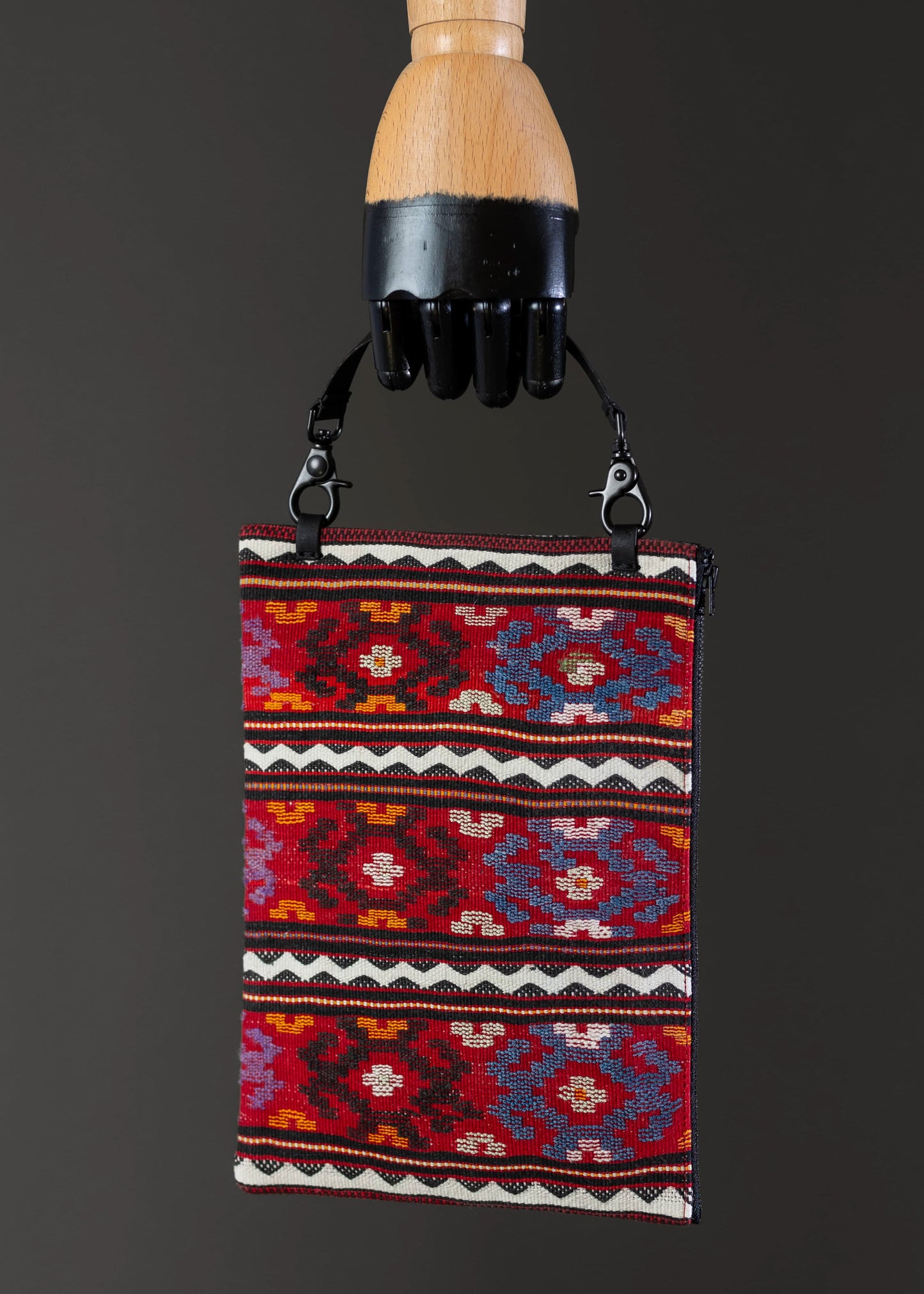 Front view of FTLO multicolor geometric clutch, showcasing vibrant Romanian patterns.