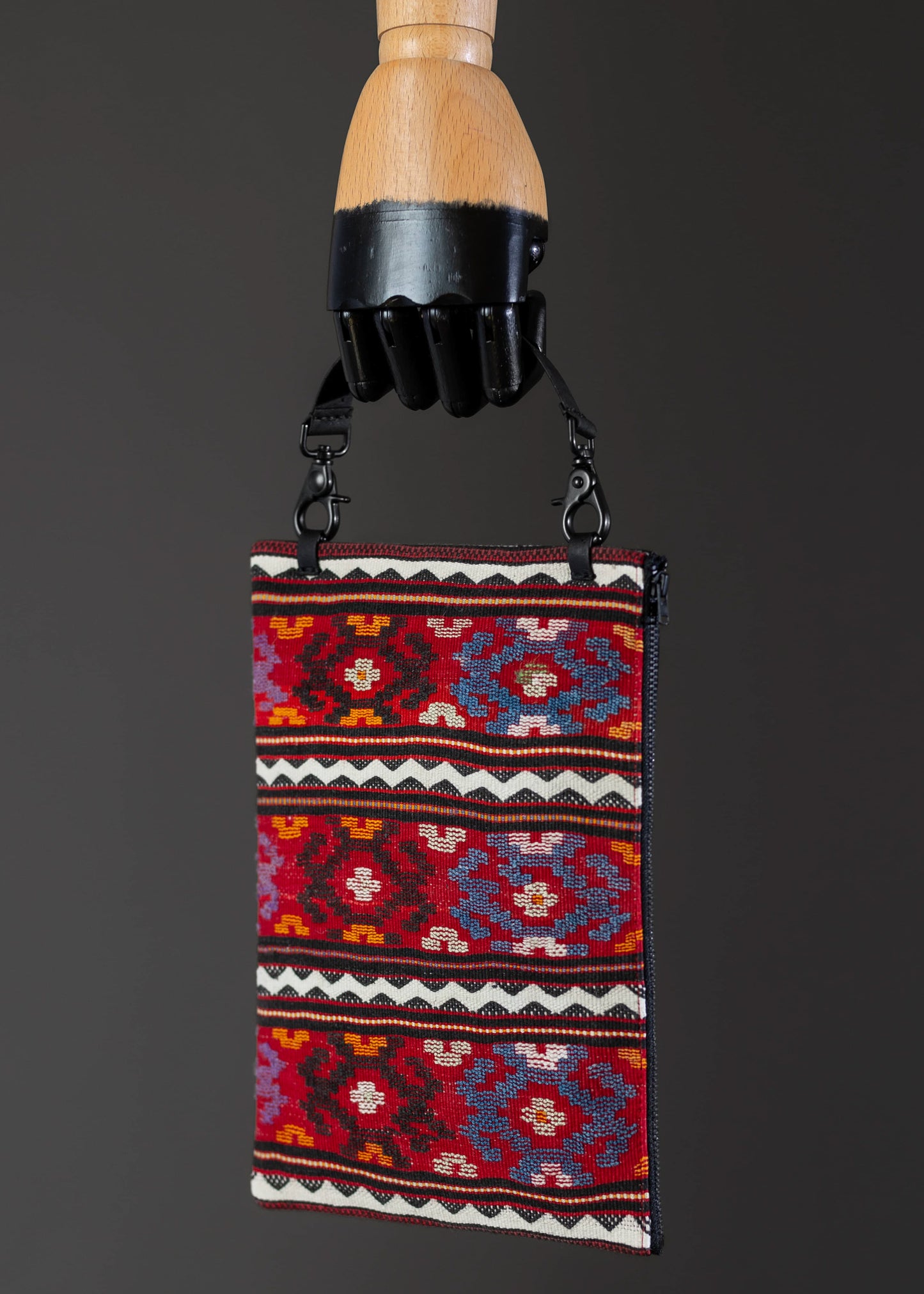 Side view of FTLO multicolor geometric pattern clutch, emphasizing detailed craftsmanship.