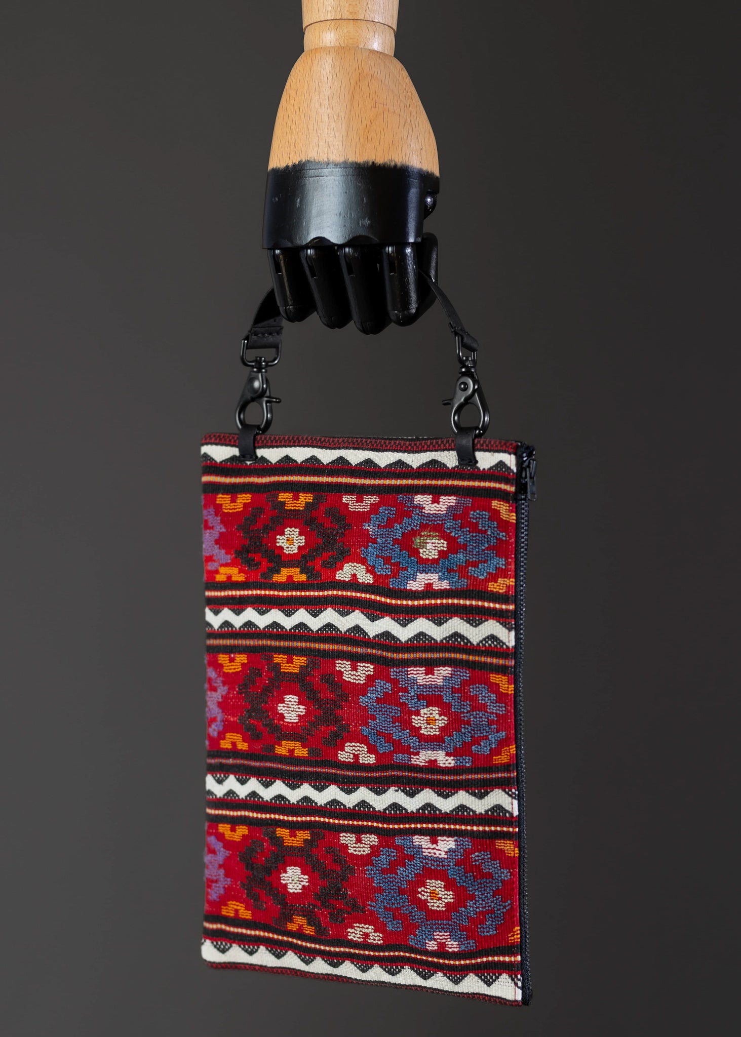 Side view of FTLO multicolor geometric pattern clutch, emphasizing detailed craftsmanship.