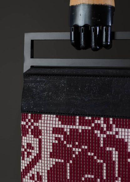 Close-up detail of FTLO bag highlighting the pixelated rose design and the texture of the weave.