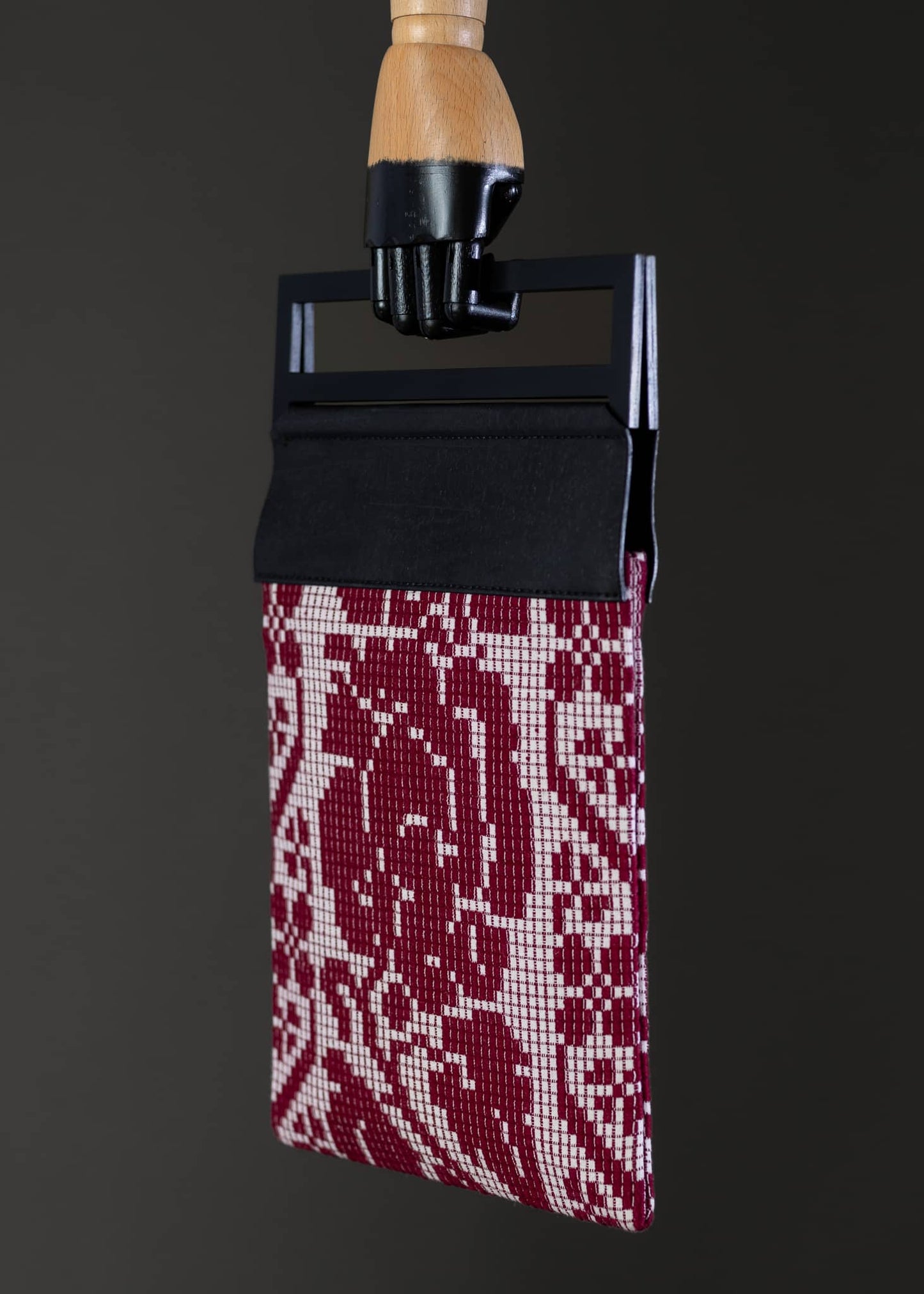 Side view of FTLO bag with a pixelated rose pattern, focusing on the intricate weaving.