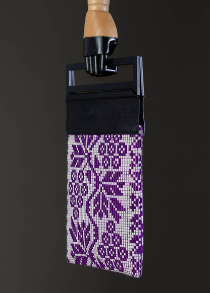 Side view of the FTLO bag highlighting the compact design with a purple grapes motif.