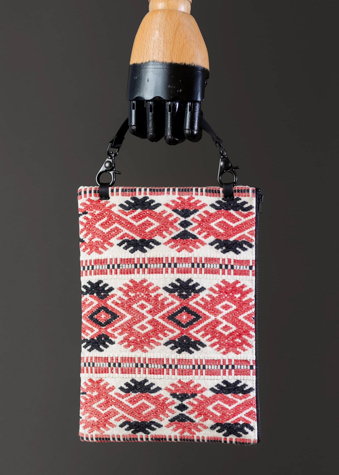 Front view of FTLO red and black geometric pattern vintage Romanian handwoven bag.