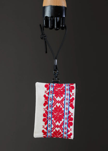 Front view of FTLO small bag showcasing red and blue geometric patterns.