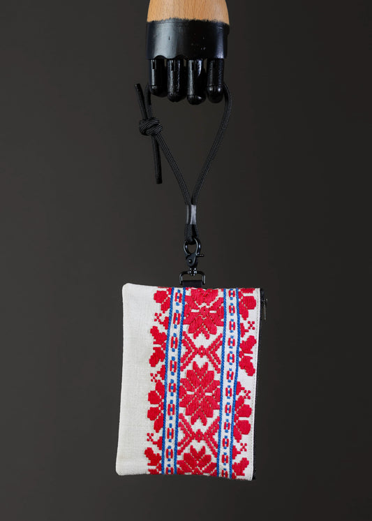 Front view of FTLO small bag showcasing red and blue geometric patterns.