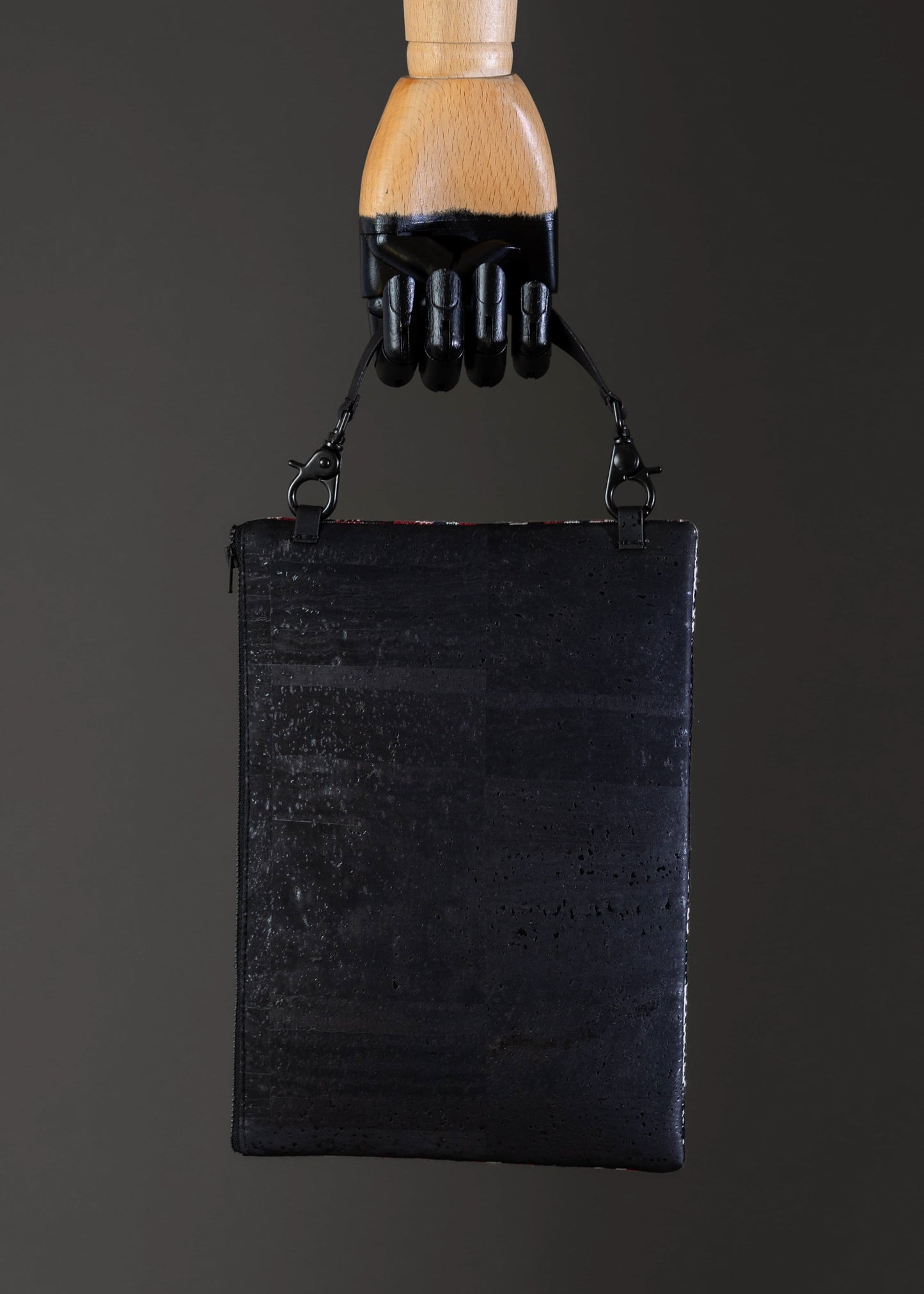 Back view of the red geometric FTLO clutch showing the black cork.