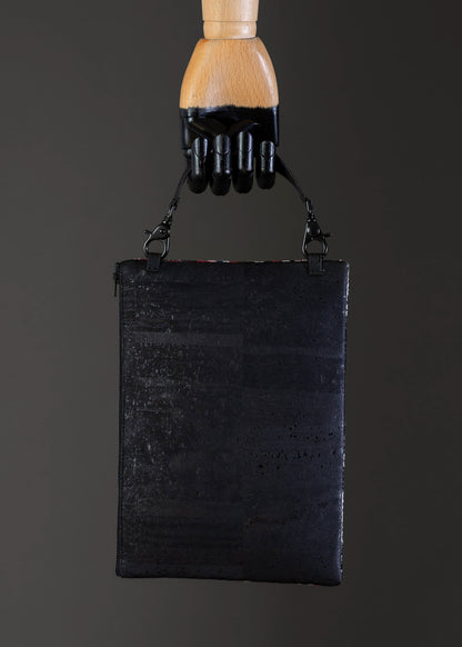 Back view of the red geometric FTLO clutch showing the black cork.