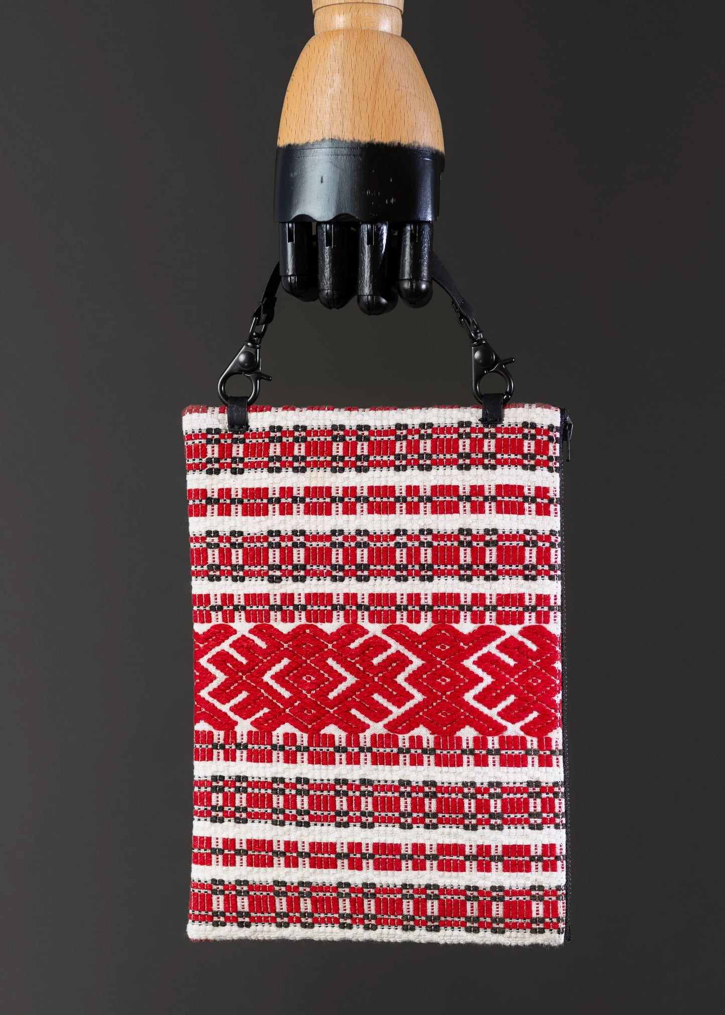 Front view of FTLO bag featuring red geometric embroidery on a vintage Romanian design.