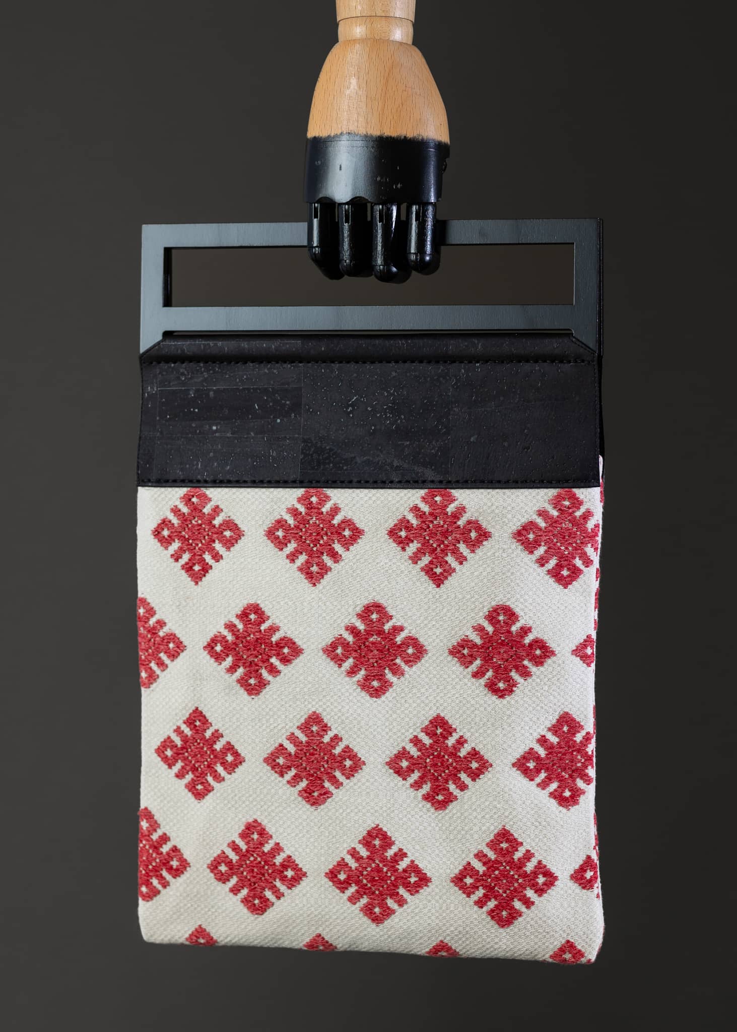 Front view of FTLO bag featuring red and white diamond patterns on a textured fabric.