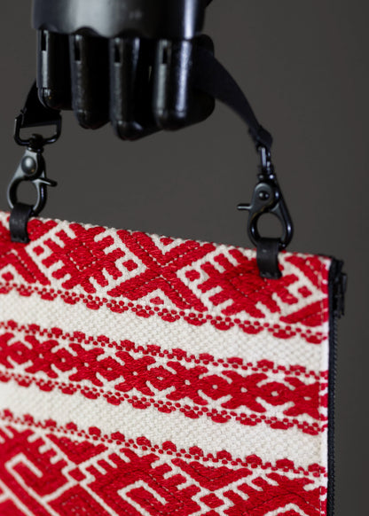 Detailed craftsmanship on FTLO red and white geometric patterned handwoven vintage bag.