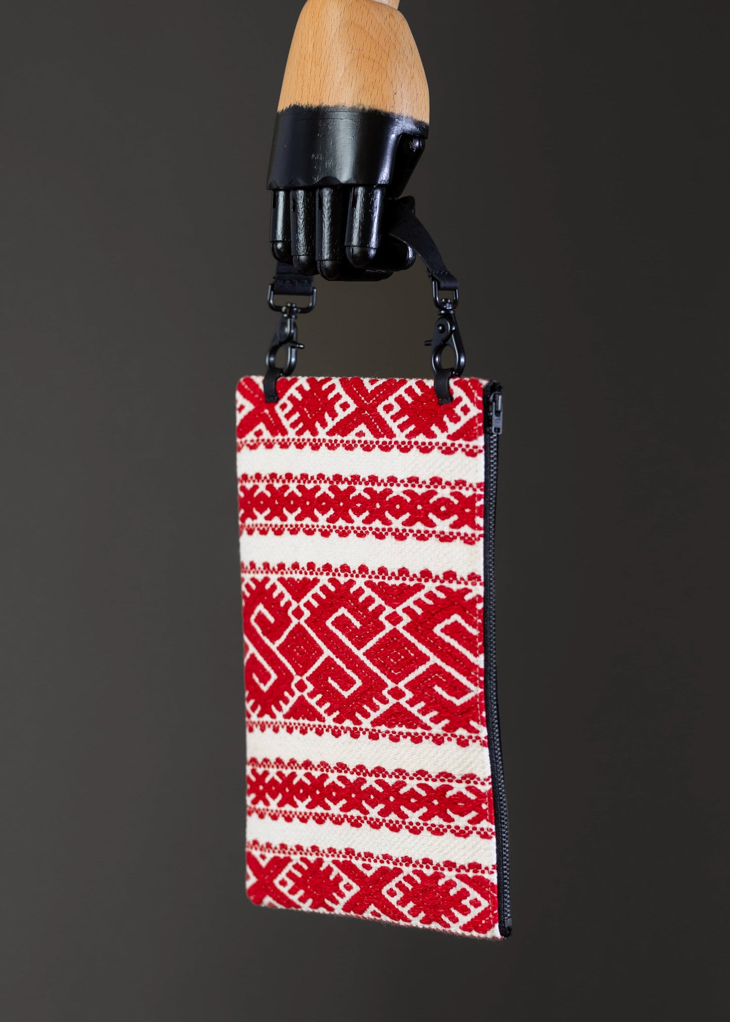 FTLO red and white geometric bag showcasing the black cork fabric on the back.