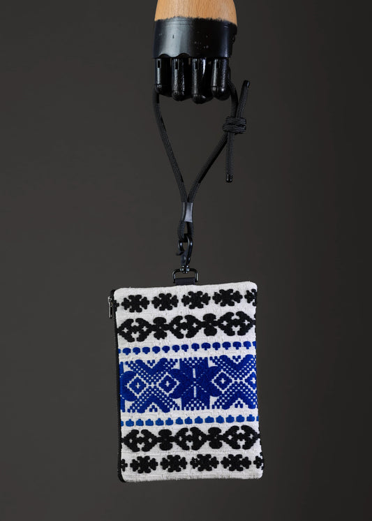 Front view of FTLO small bag with black and blue handwoven pattern.