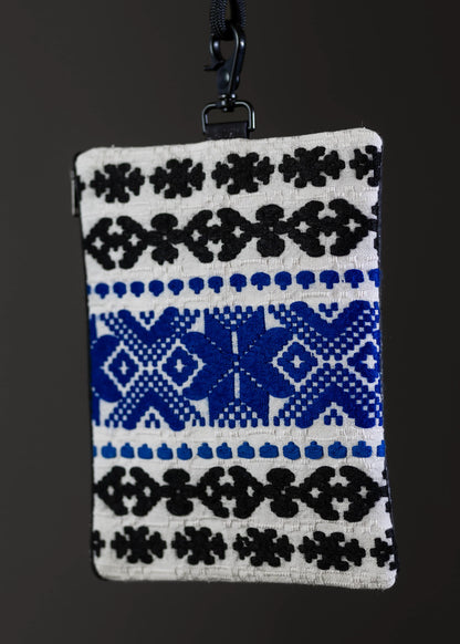 Artistic motif on FTLO small bag featuring traditional black and blue handwoven design.