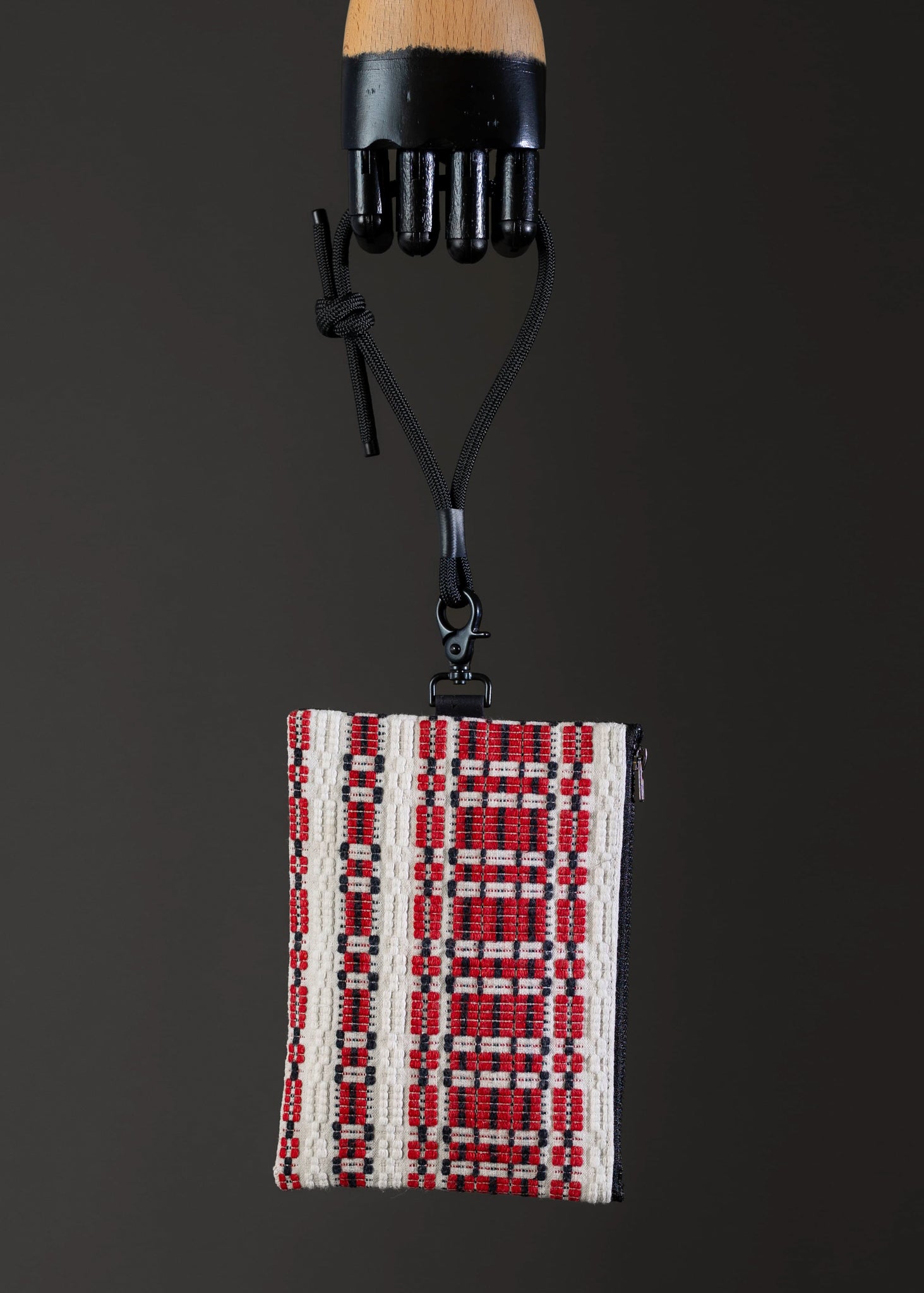 Front view of FTLO small bag with red and white traditional weave.