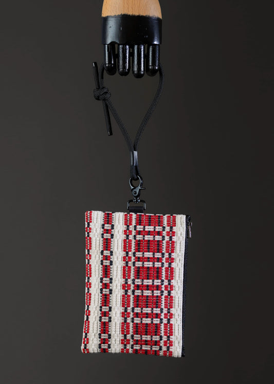 Front view of FTLO small bag with red and white traditional weave.