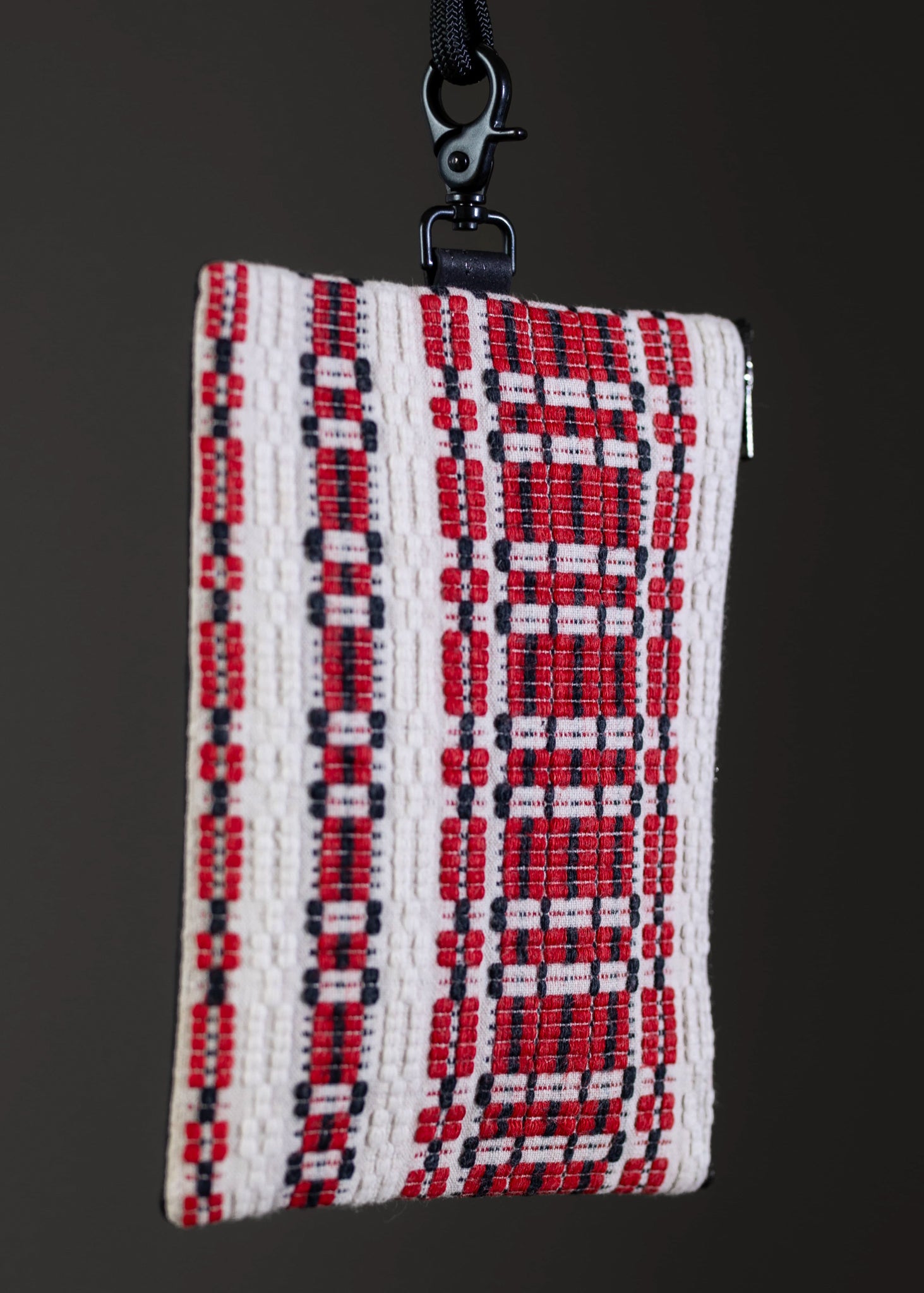 "Detail of FTLO small bag's red and white intricate handwoven design.