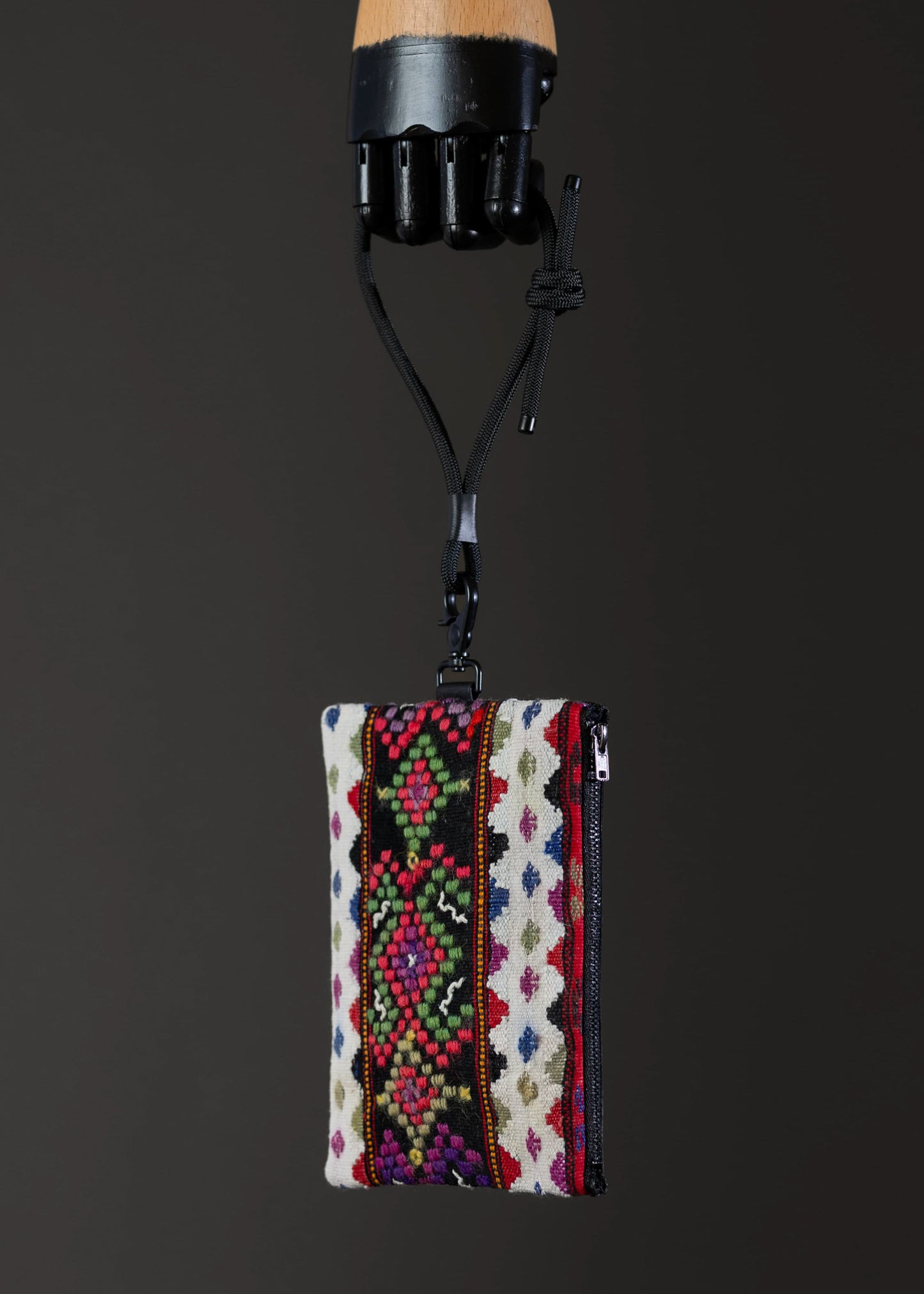 Side view of the small FTLO bag highlighting the contrast of geometric designs.