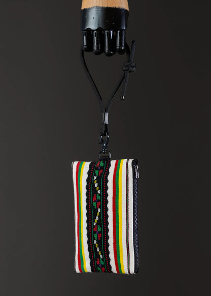 Side view of FTLO striped multicolor patterned bag.