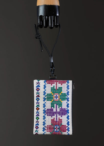 Front view of FTLO's traditional woven bag, showcasing a vibrant color palette.