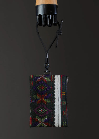 Front view of the small FTLO bag showing a rich tapestry of vivid multicolored embroidery.