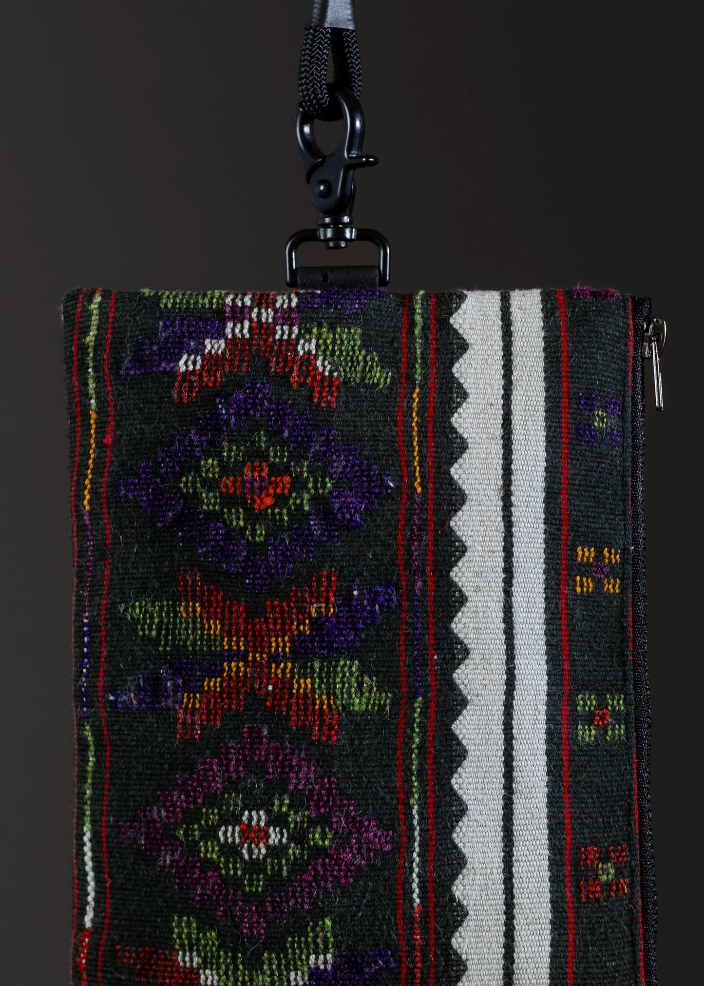 Detailed motif of the small FTLO bag featuring an array of bright, multicolored embroidery.